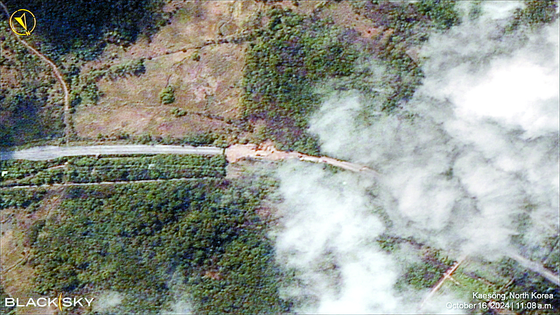 A satellite view of a damaged border road over Kaesong, North Korea, after North Korea's KCNA news agency reported that the military had blasted sections of road and rail links with South Korea on Oct.16. [REUTERS/YONHAP] 