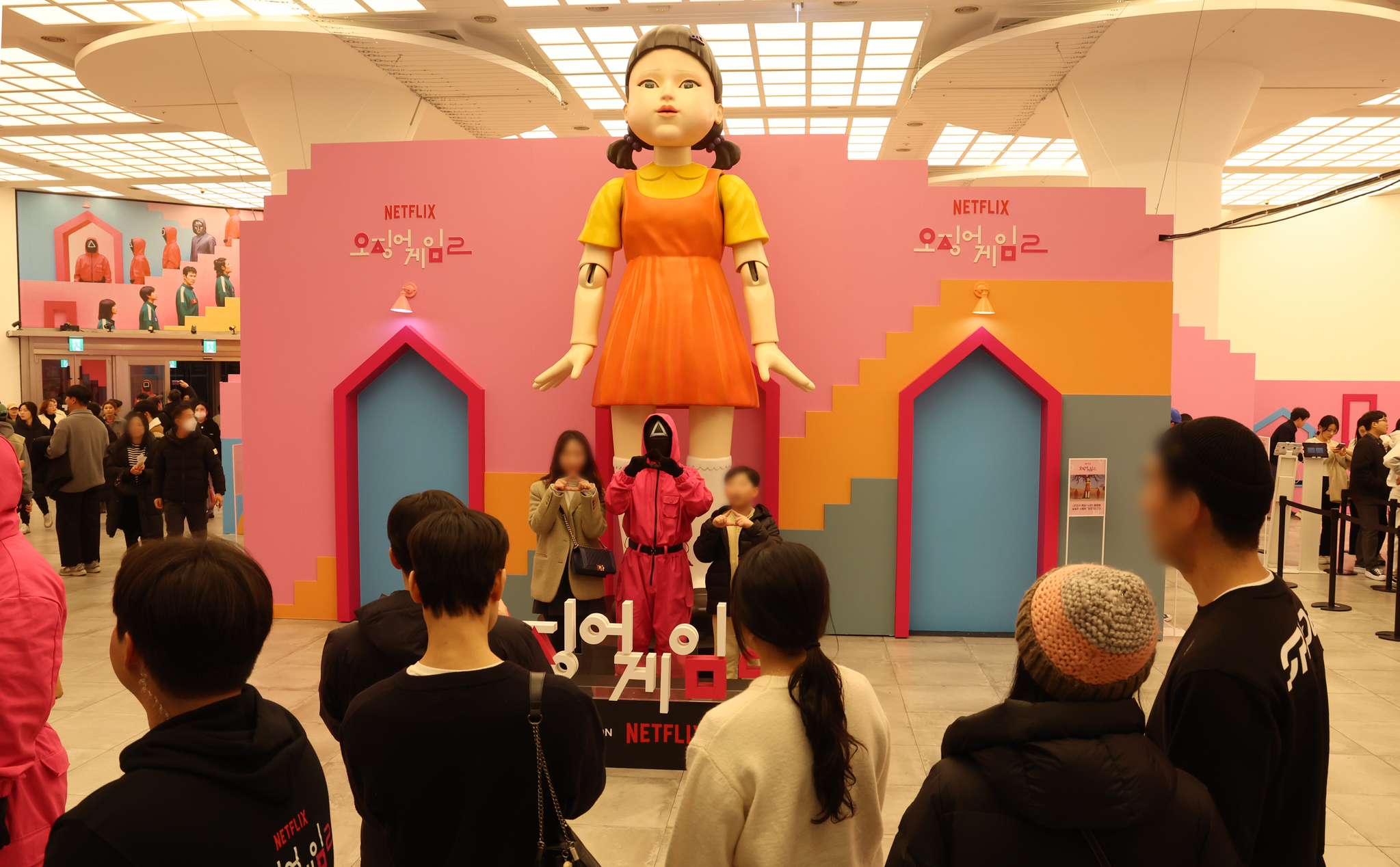 People take photos at a pop-up store set in Shinsegae Department Store in Centum City, Busan, on Dec. 22. [YONHAP]