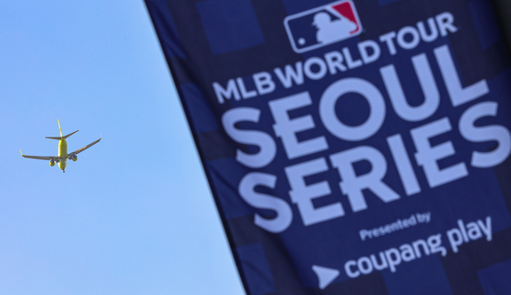 The MLB Seoul Series flag is seen outside Gocheok Sky Dome in western Seoul on March 13. [NEWS1]