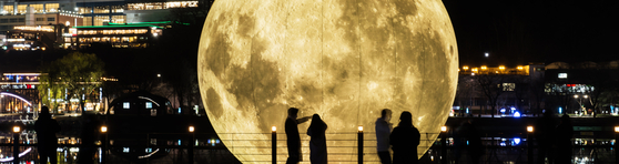 Visitors enjoy the night at the Light Art Festival Suseong in Suseong District, Daegu [LIGHT ART FESTIVAL SUSEONG]