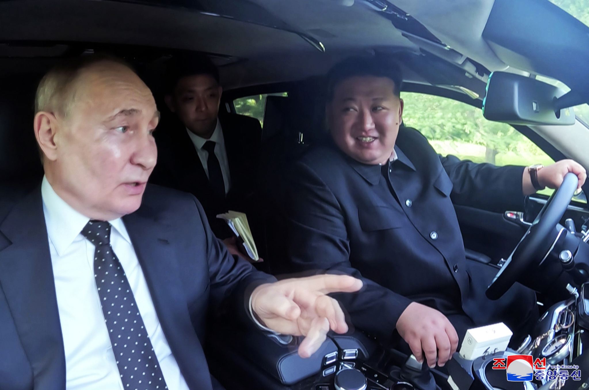 North Korean leader Kim Jong-un, right, drives a vehicle while talking with Russian President Vladimir Putin, left, who visited Pyongyang to hold summit talks with the North's leader. [KOREAN CENTRAL NEWS AGENCY]
