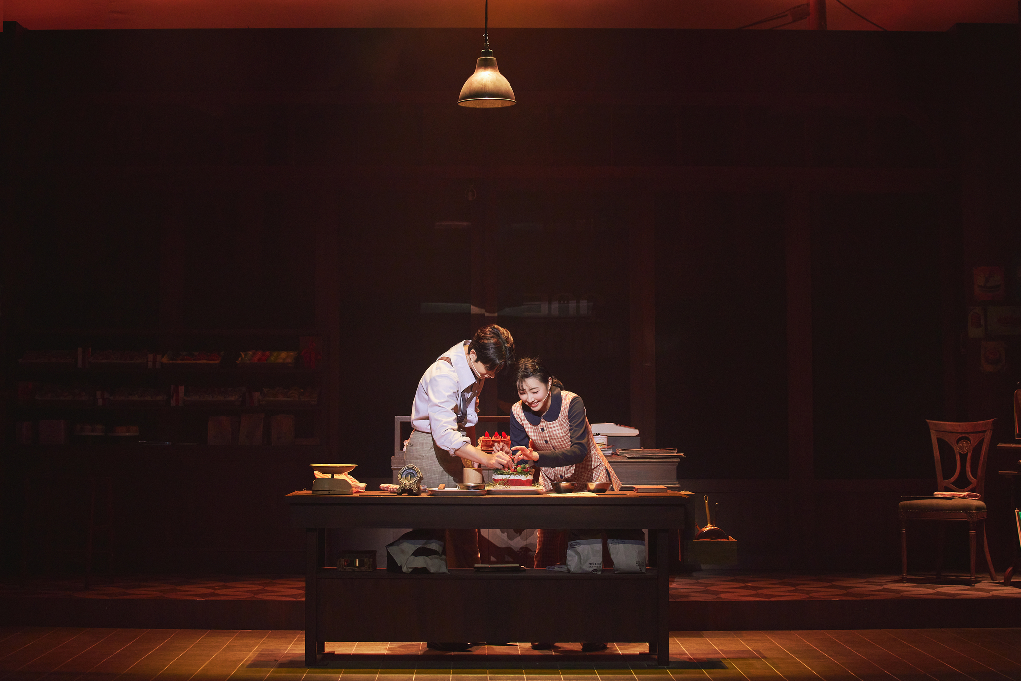 Lee Bom-sori as aspiring baker Sun-hee, right, and Lee Jae-hwan as the ghost in the ongoing run of horror rom-com musical "Ghost Bakery" at the Doosan Art Center in Jongno District, central Seoul [LIBRARY COMPANY]