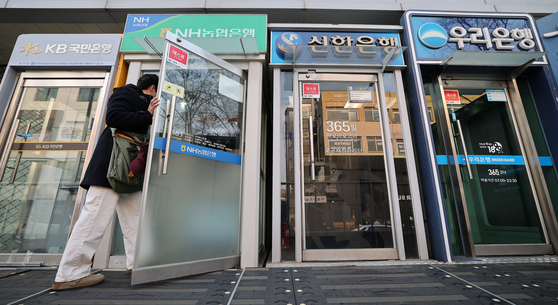 A person enters a booth for an automated teller machine, or ATM, in Seoul on Dec. 30, 2024. [NEWS1]