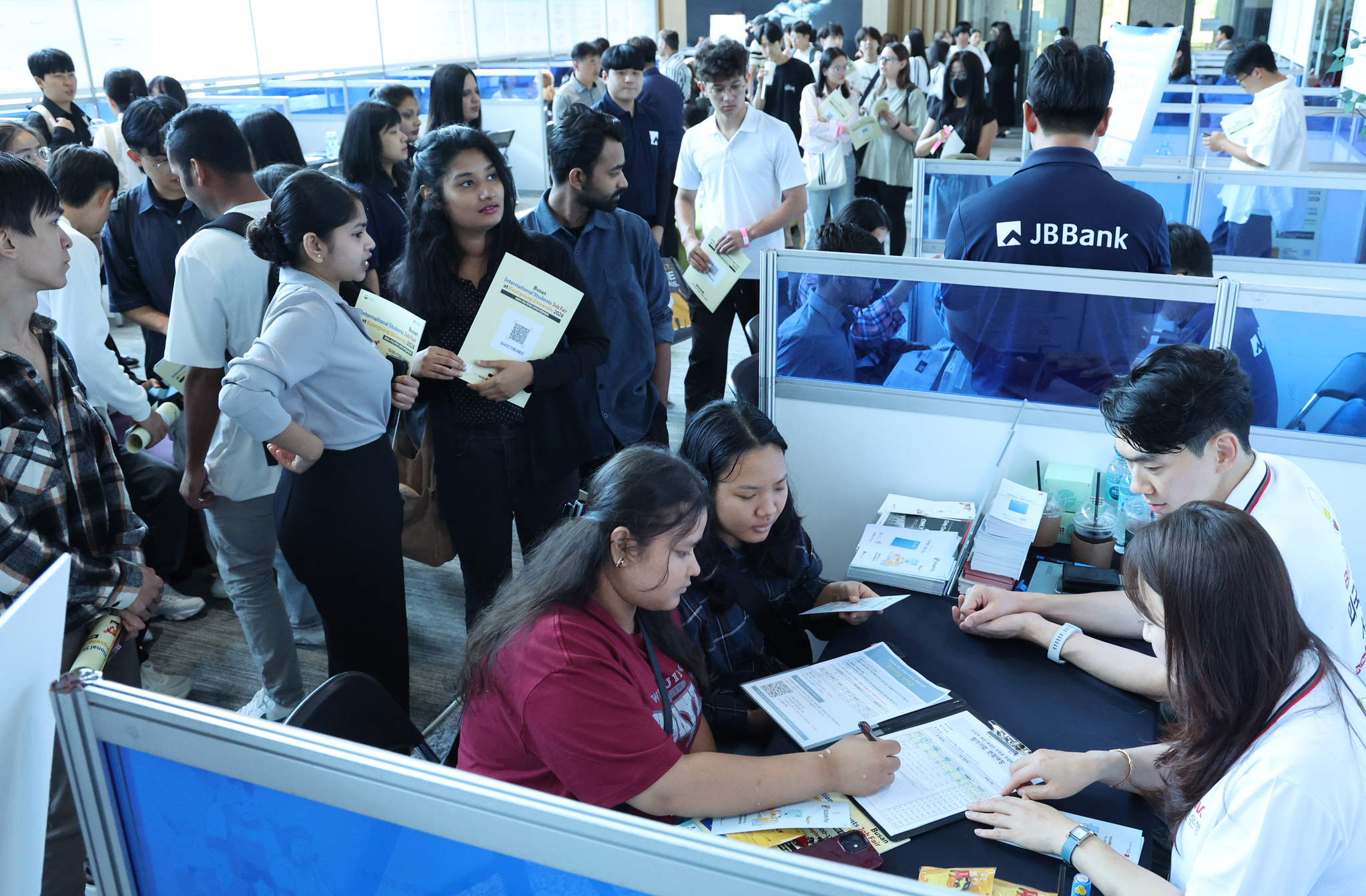 International students have a counseling session with a recruiting company at an international student job fair held at Kyungsung University on Sept. 27, 2024. [YONHAP] 
