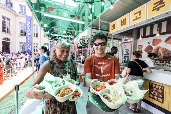 People in Paris during the Paris 2024 Olympics eat tteokbokki at a K-culture complex set up by the Korean government on July 28, 2024. [JOINT PRESS CORPS] 