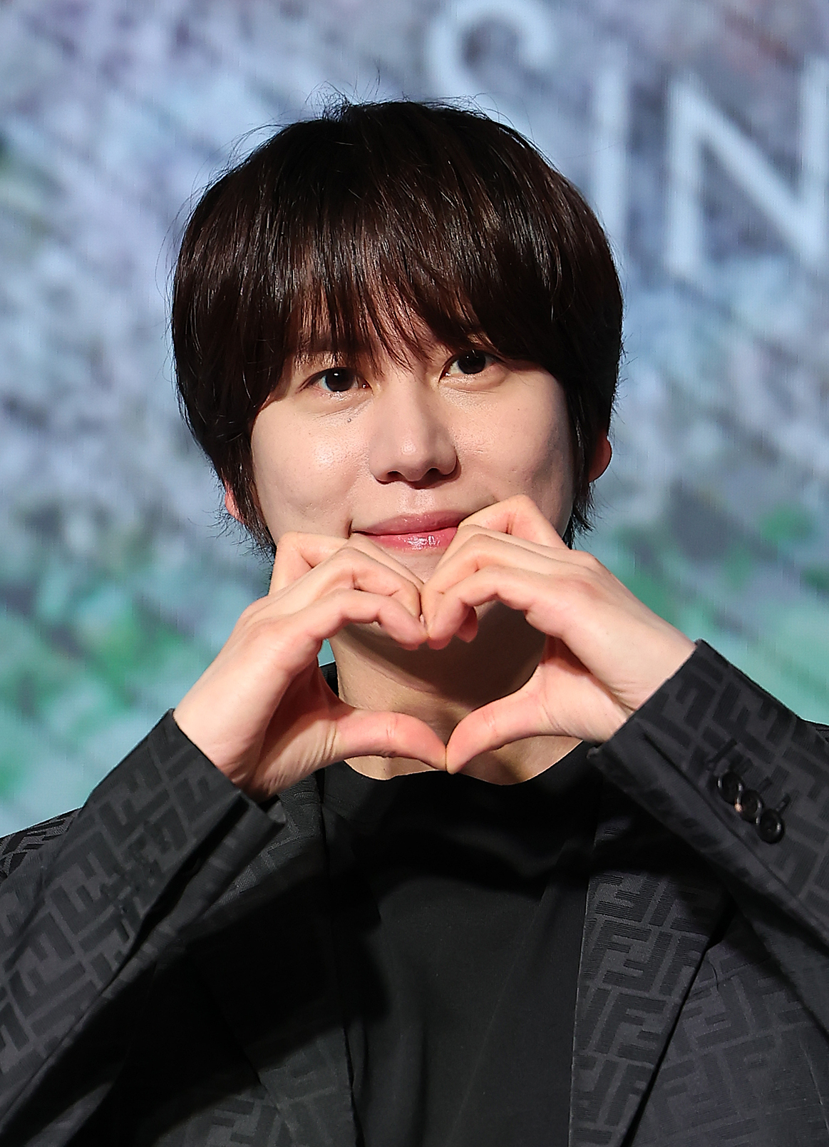 Kyuhyun poses for photos at a press conference held on Jan. 8 at Hotel Naru Seoul MGallery in Mapo District, western Seoul. [NEWS1]