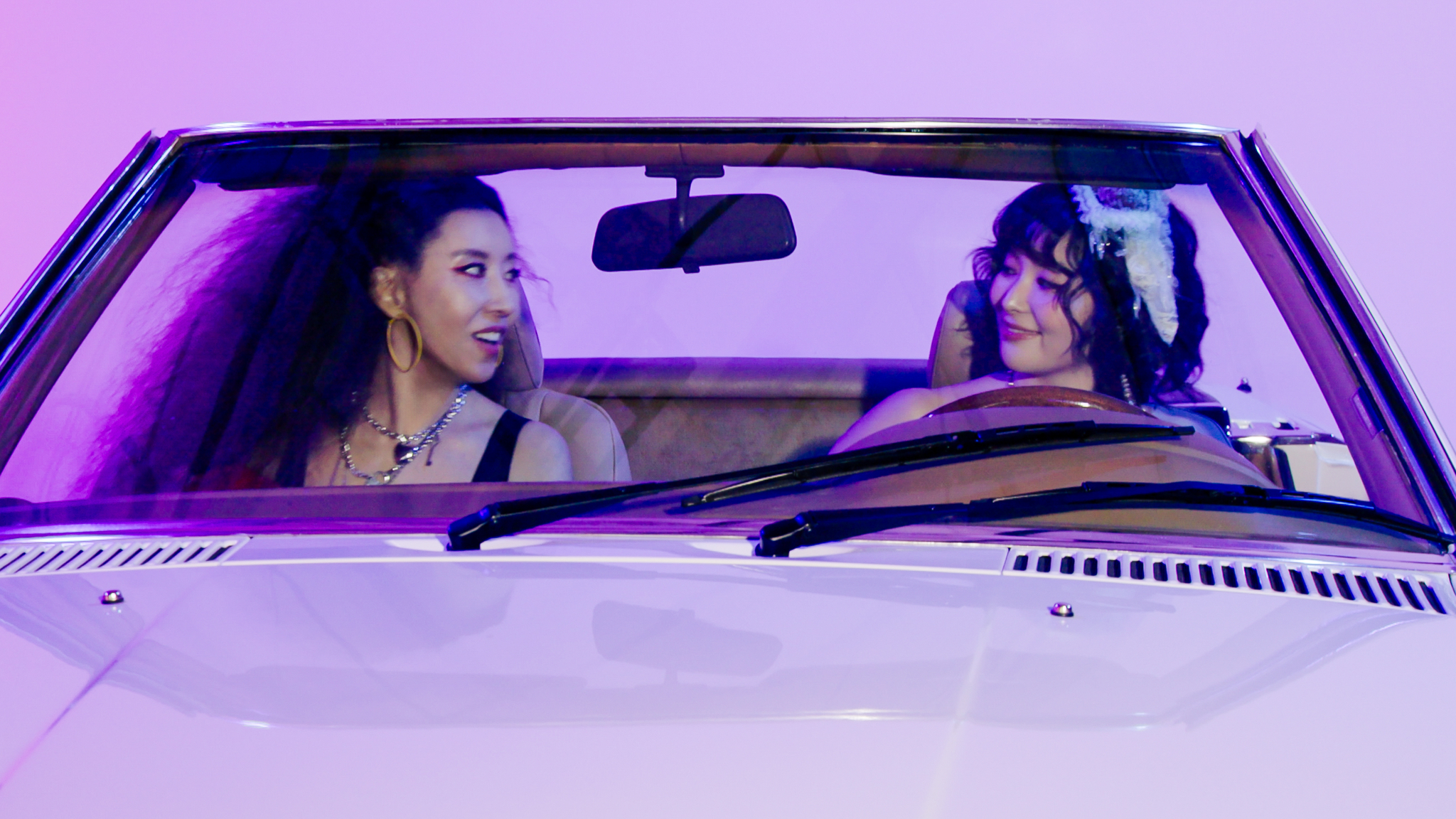 Kim Wan-sun, left, and Seulhi featured in the music video of ″Lucky″ [KWSUNFLOWER]