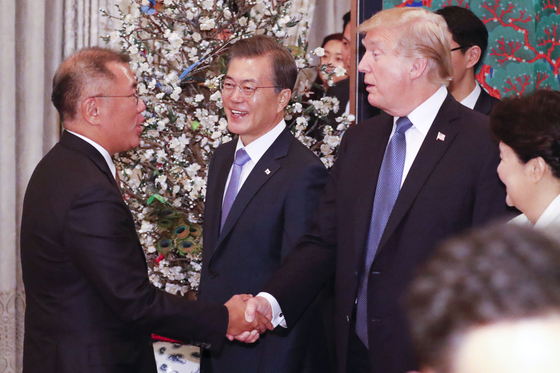 Hyundai Motor Group Executive Chair Euisun Chung, far left, greets with President Donald Trump, right, during his visit to Korea in his first term on Nov. 7, 2017. [JOINT PRESS CORPS] 