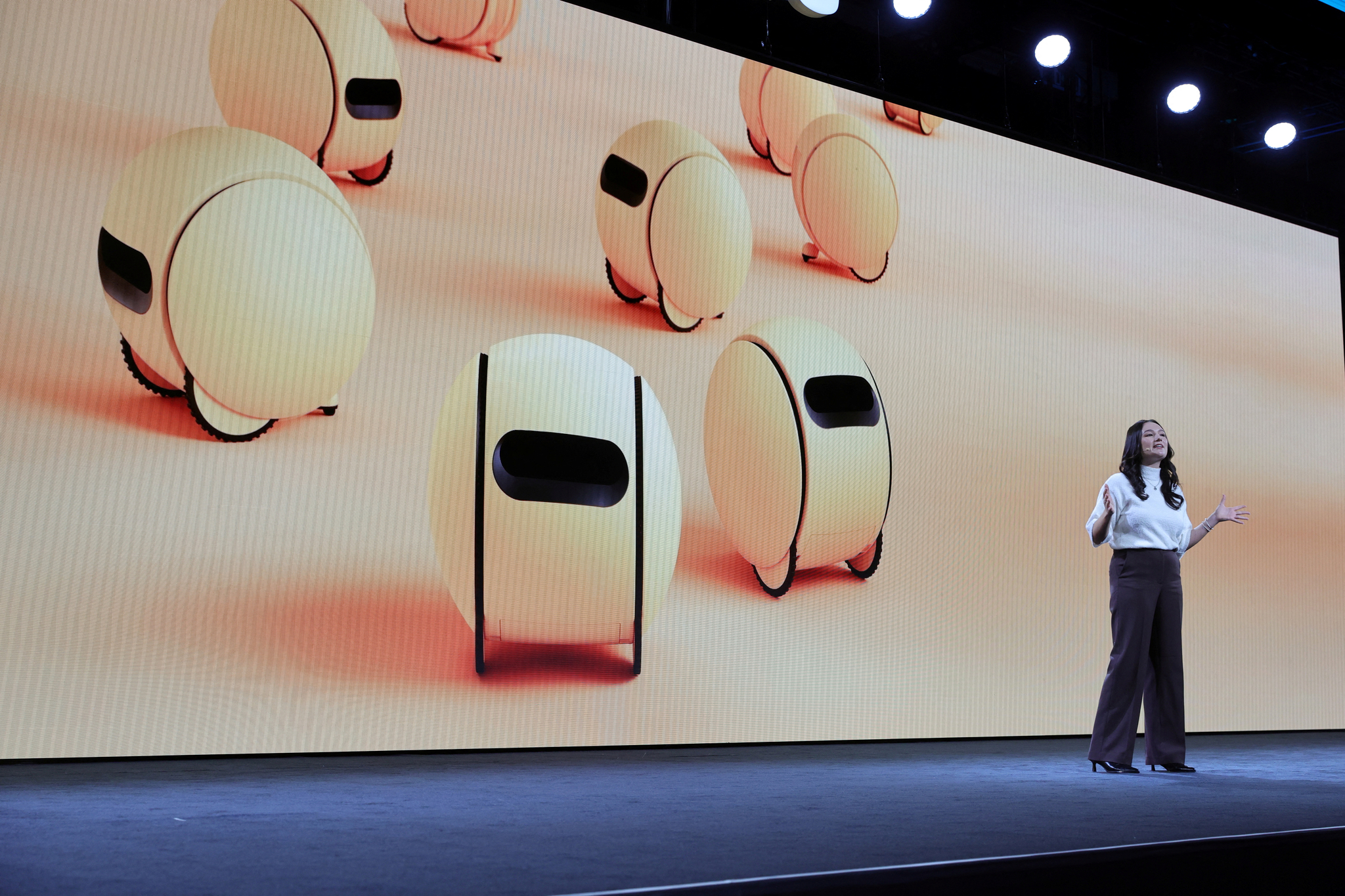 Alana Gomez-Solis, a marketing communications specialist at Samsung Electronics America, discusses the company's AI home robot Ballie during a Samsung Electronics news conference at CES 2025 in Las Vegas on Jan. 6. [REUTERS/YONHAP]