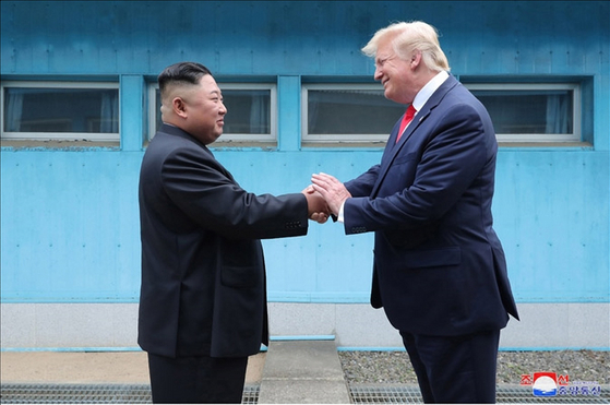 Former U.S. President Donald Trump shakes hands with North Korean leader Kim Jong-un at Panmunjom in the demilitarized zone (DMZ) on June 30, 2019, in this photo released by North Korea's state-run Korean Central News Agency. [YONHAP]