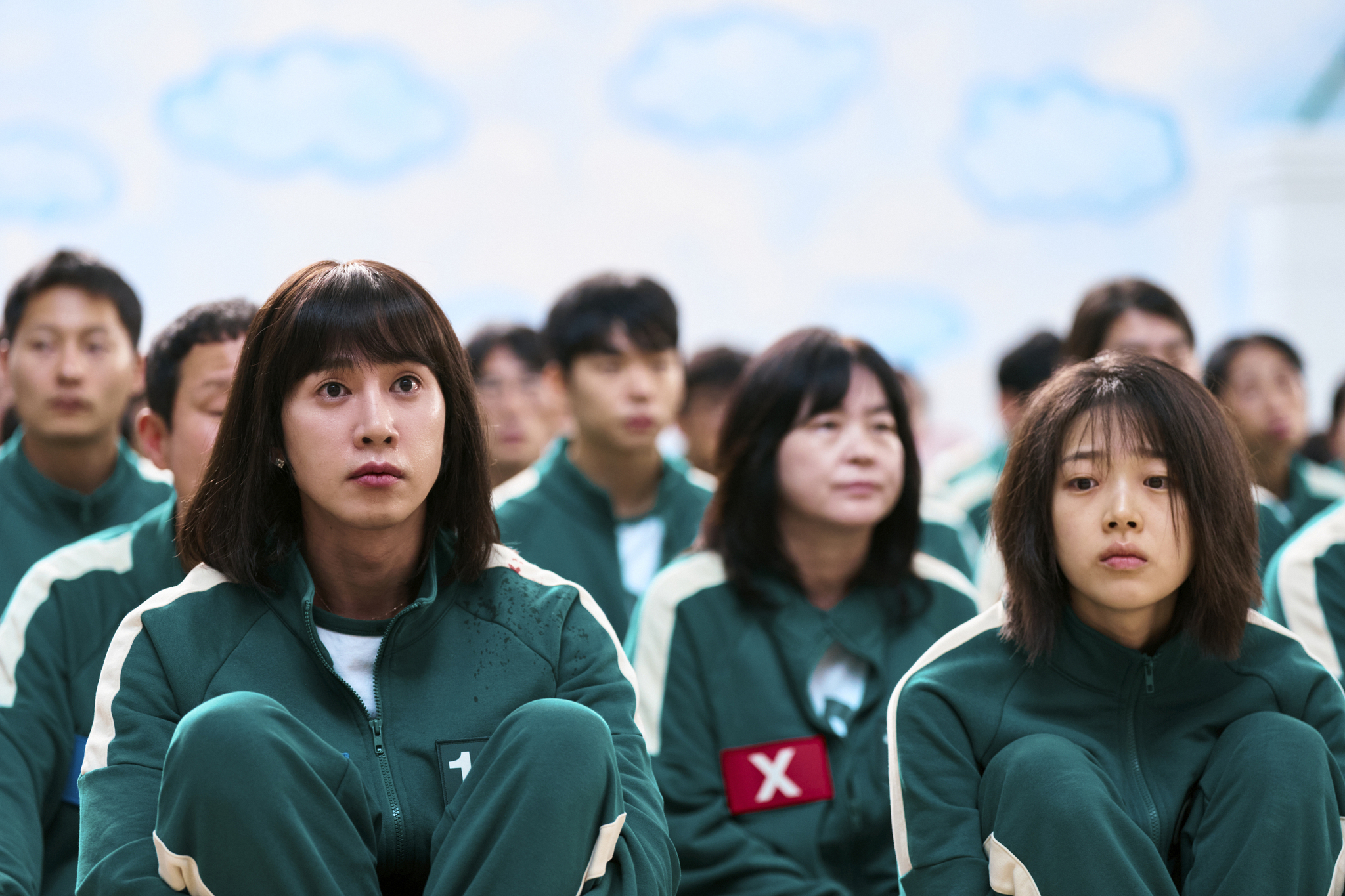 A still from the second season of ″Squid Game″ (2021-), featuring Park Sung-hoon, left, as Hyun-ju [NETFLIX]