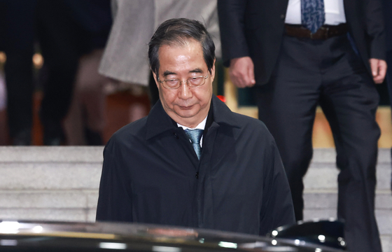 Suspended Prime Minister Han Duck-soo leaves the government complex in central Seoul after the National Assembly voted to impeach him on Dec. 27, 2024. [YONHAP] 