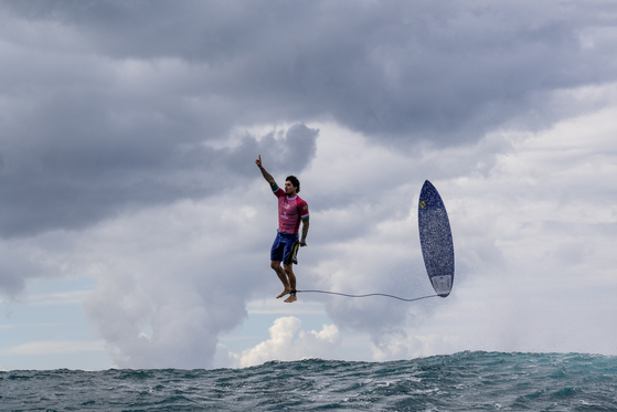 Golden Moment - Overall winner. Gabriel Medina celebrates in round three of the men’s surfing competition at the Paris Olympics.  [JEROME BROUILLET/WSPA]