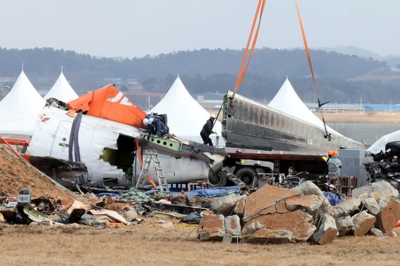 Aircraft wreckage from a Jeju Air 737-800 that crashed on Dec. 29 being recovered at Muan International Airport in South Jeolla on Jan. 15.[YONHAP]