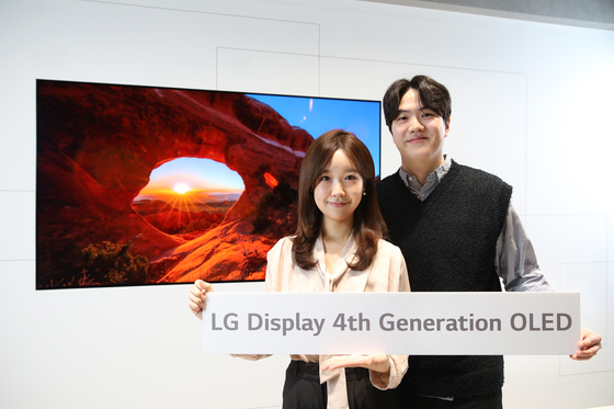 Models pose with LG Display's 4th Generation OLED panel. [LG DISPLAY]