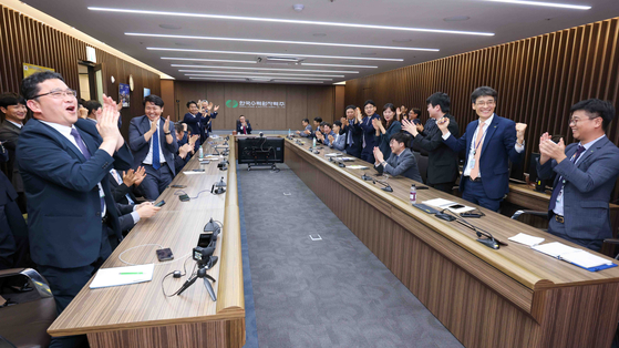 Korea Hydro & Nuclear Power employees cheer upon hearing the announcement on July 17, 2024, that the company was selected as the preferred bidder for a nuclear power project in the Czech Republic. [YONHAP]