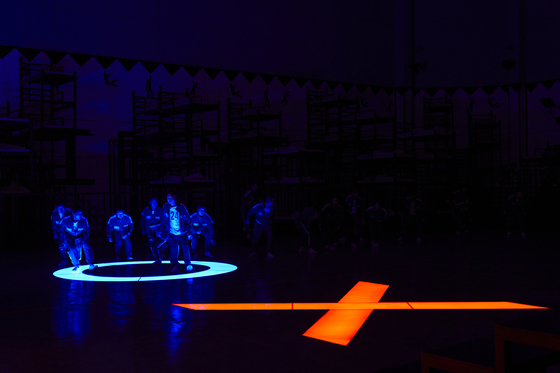 A still from season two of Netflix's ″Squid Game″ (2021-) showing the blue ″O″ and red ″X″ when players voted for the continuance of the game [NETFLIX]