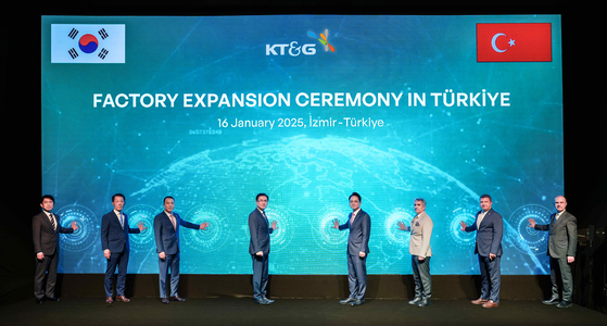 Fourth from left, Korean Ambassador to Turkey Jung Yeon-doo, KT&G CEO Bang Kyung-man and Tire District Governor Vural Karagu pose during KT&G's Turkish factory expansion ceremony held Jan. 16. [KT&G]