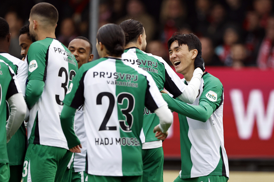 Feyenoord Hwang In-beom, right, celebrates with his teammates during the Eredivisie match against Almere City in Almere, Netherlands on Nov. 10, 2024. [EPA/YONHAP] 