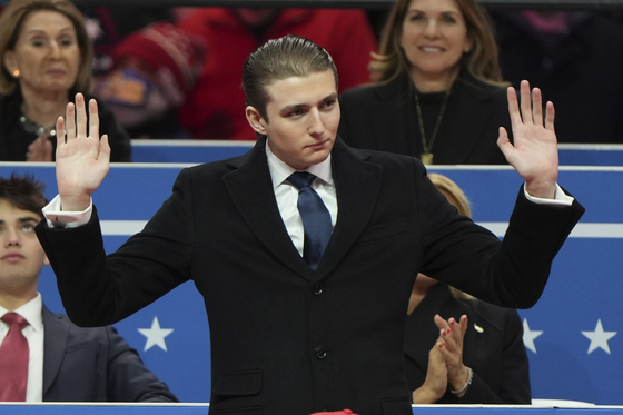 Barron Trump waves at an indoor Presidential Inauguration parade event in Washington, Jan. 20. [AP/YONHAP]