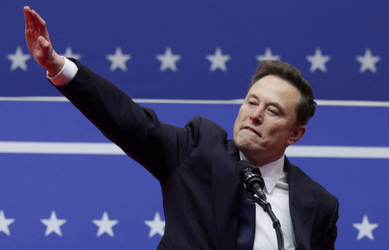 Tesla CEO Elon Musk gestures during a rally on the inauguration day of U.S. President Donald Trump's second Presidential term, inside Capital One, in Washington, Jan. 20. [REUTERS/YONHAP]