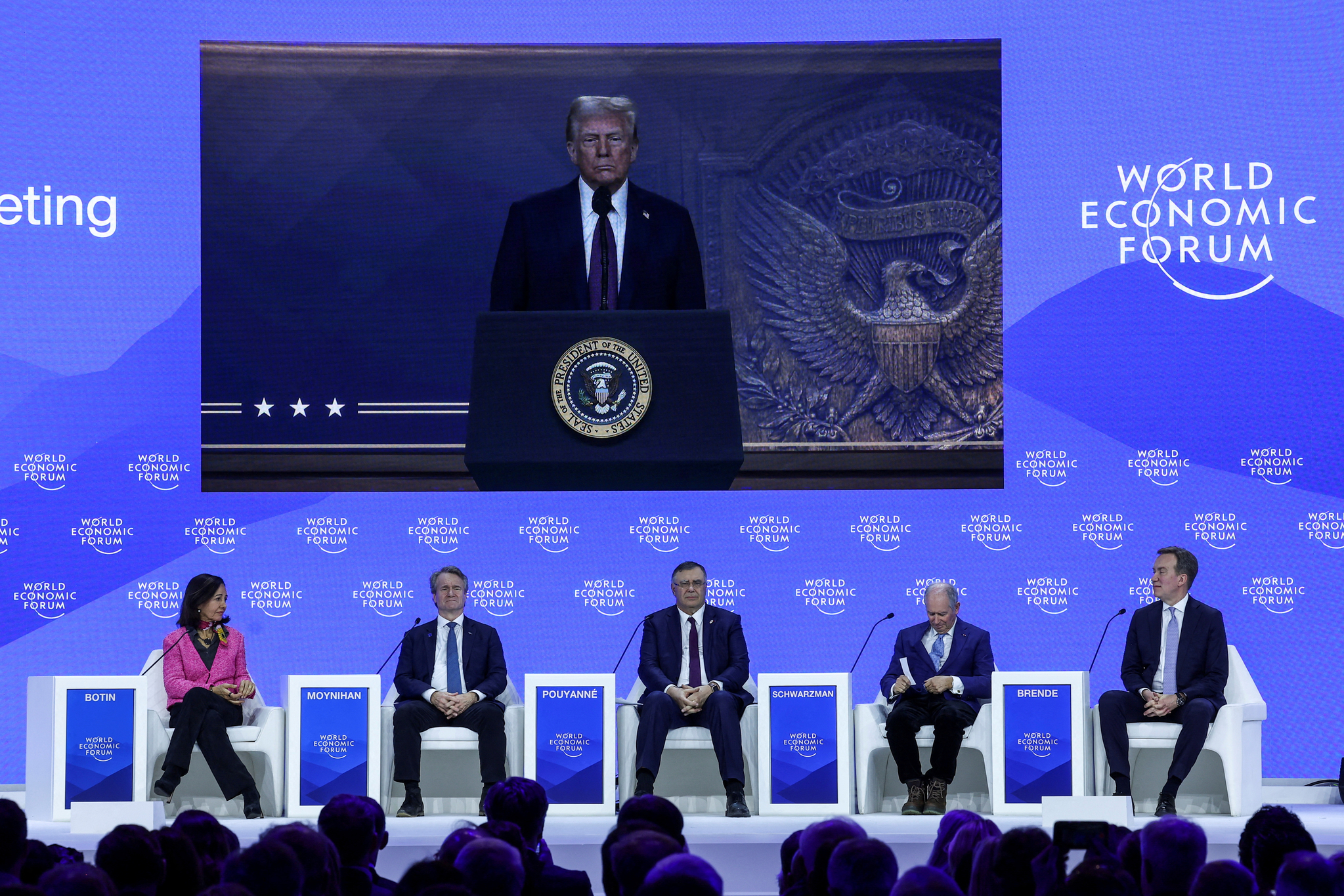 U.S. President Donald Trump makes a special address remotely as Ana?atricia?otin, chairwoman of the Spanish bank Santander, Brian Moynihan, CEO of Bank of America, Patrick Pouyanne, CEO of TotalEnergies, Stephen Schwarzman, CEO and Co-Founder of Blackstone Group and Borge Brende, President and CEO of World Economic Forum attend the 55th annual World Economic Forum (WEF) meeting in Davos, Switzerland, on Jan. 23. [REUTERS]