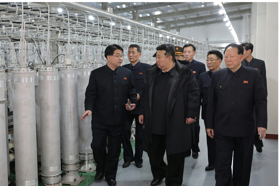 Kim Jong-un (middle) inspects a nuclear material production base and a nuclear weapons research facility on Jan. 29. [NEWS1]