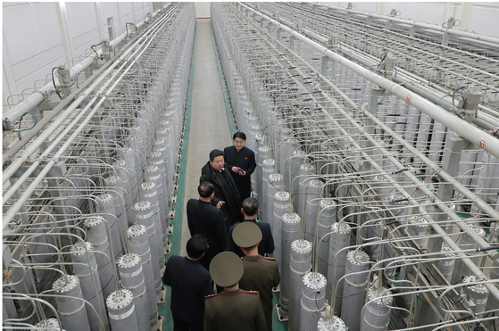 Kim Jong-un (2nd from top) inspects the nuclear-material production base with officials on Jan. 29. [NEWS1]
