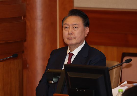 President Yoon Suk Yeol sits attends his impeachment trial hearing at the Constitutional Court in Jongno District, central Seoul, on Jan. 23. [JOINT PRESS CORPS] 