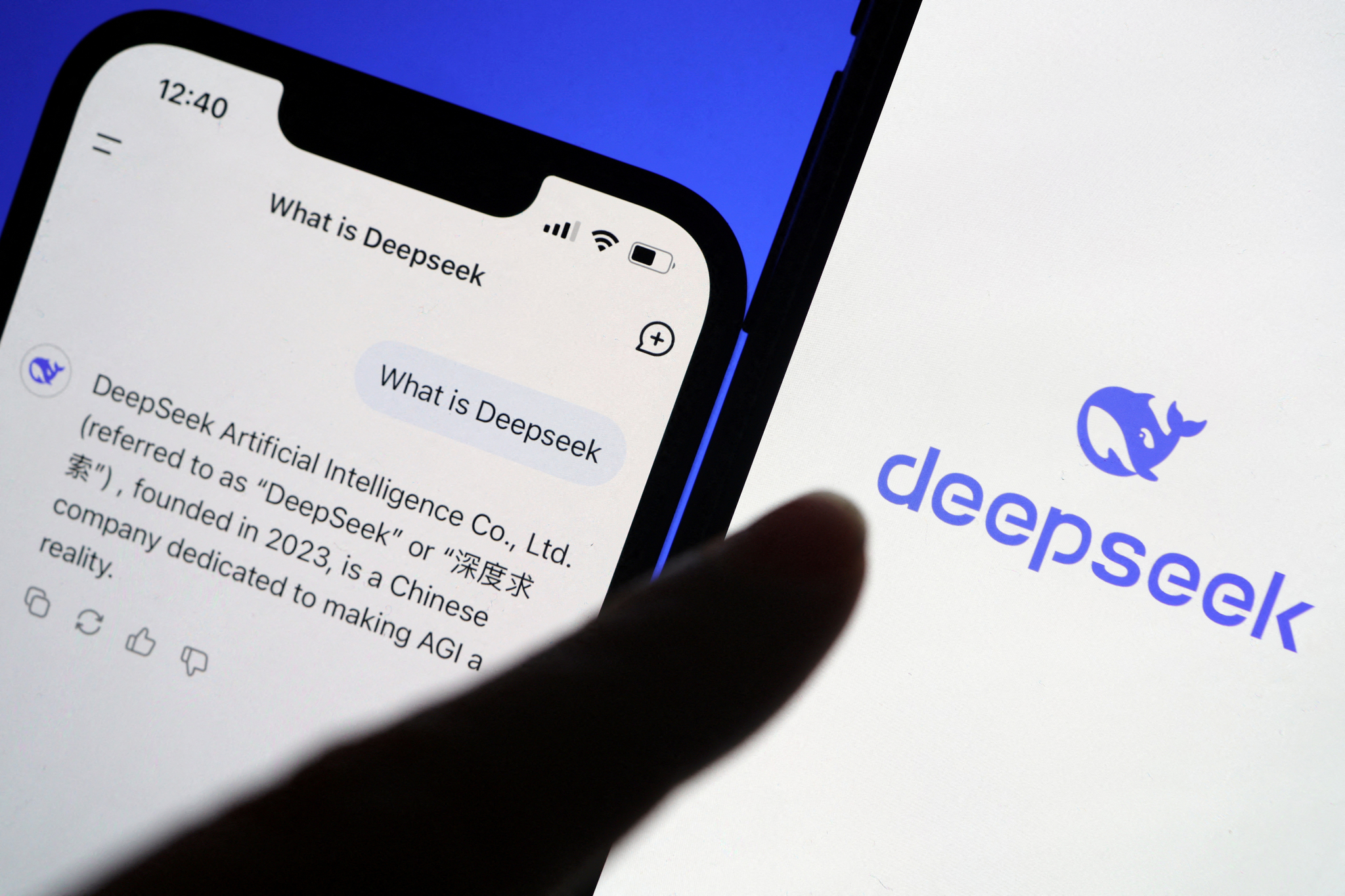 The logo of DeepSeek is displayed alongside its AI assistant app on a mobile phone, in this illustration picture taken on Jan. 28. [REUTERS/YONHAP]