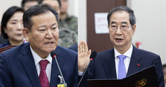 Former Interior Minister Lee Sang-min, left, and Prime Minister Han Duck-soo attend the first parliamentary hearing on President Yoon Suk Yeol's alleged insurrection, held at the National Assembly in Seoul on Jan. 22. [NEWS1]