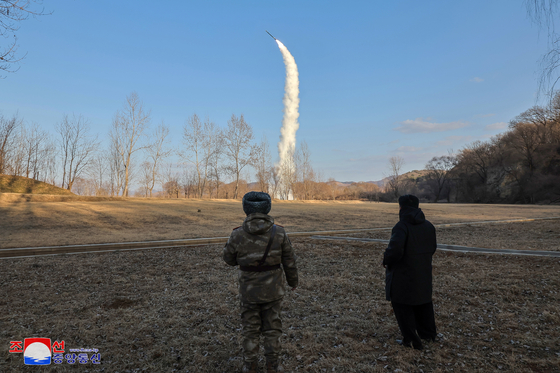 North Korean leader Kim Jong-un observes a test launch of sea-to-surface strategic cruise guided missiles on Jan. 25 in this file photo Korean Central News Agency released the following day. [YONHAP]