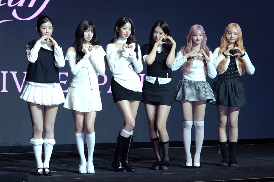 Members of girl group IVE pose for photos during a press conference held on Feb. 3 at the Conrad Seoul hotel in western Seoul for the release of the group's third EP "IVE Empathy." [KIM MYEONG-JI]