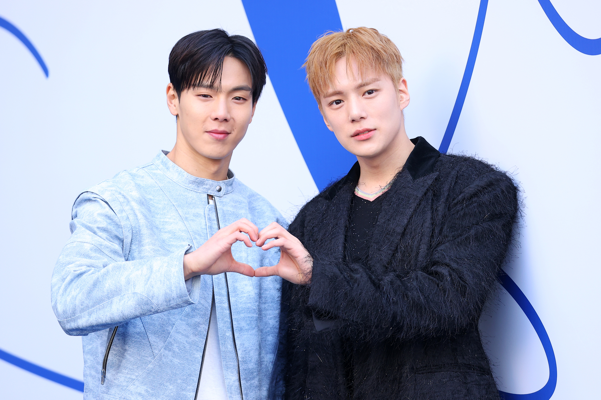 Boy band Monsta X's Shownu, left, and Minhyuk attend Seoul Fashion Week 2025 Fall/Winter at Dongdaemun Design Plaza in Jung District, central Seoul, on Feb. 5. [YONHAP]