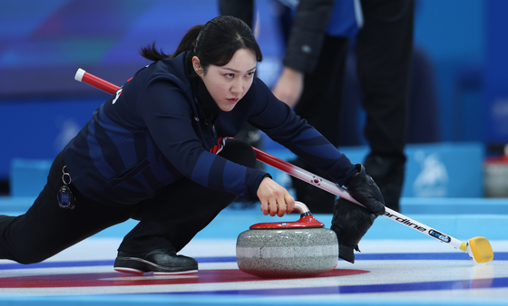 Korea's Kim Kyeong-ae competes during the mixed doubles round robin group B session 8 match of curling event alongside Seong Ji-hoon against Kyrgyzstan's Keremet Asanbaeva and Iskhak Abykeev at Asian Winter Games in Harbin, China on Feb. 6. [XINHUA/YONHAP] 
