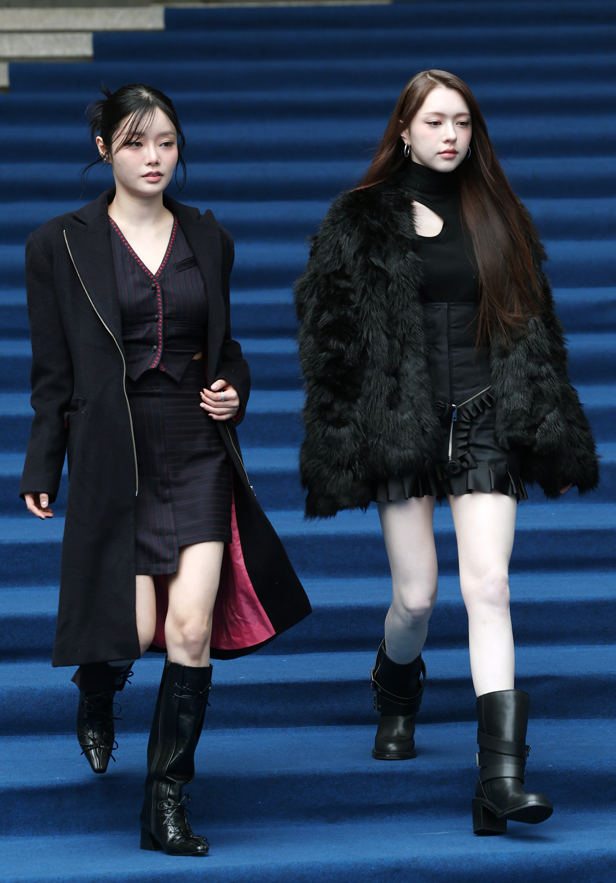 Girl group Fifty Fifty's Keena, left, and Chanelle Moon attend Seoul Fashion Week 2025 Fall/Winter at Dongdaemun Design Plaza in Jung District, central Seoul, on Feb. 6. [NEWS1]