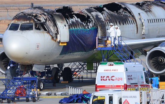 Authorities from the transportation ministry and a French agency in charge of civil aviation accidents begin a joint investigation on Feb. 3, 2025, into an Air Busan plane that was destroyed by a fire. [YONHAP]
