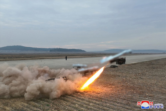 A performance test of suicide attack drones, produced by an affiliated institute of the Unmanned Aerial Technology Complex and businesses, takes place under the inspection of North Korean leader Kim Jong-un on Nov. 14, 2024. [KOREAN CENTRAL NEWS AGENCY]