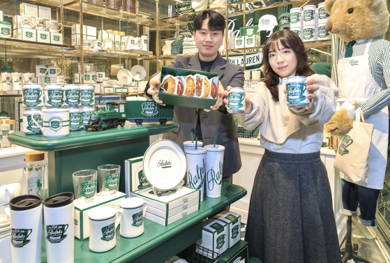 Models present products from Ralph Lauren's cafe brand, Ralph's Coffee, at the Hyundai Seoul in Yeongdeungpo District, western Seoul, on Feb. 12. [HYUNDAI DEPARTMENT STORE]