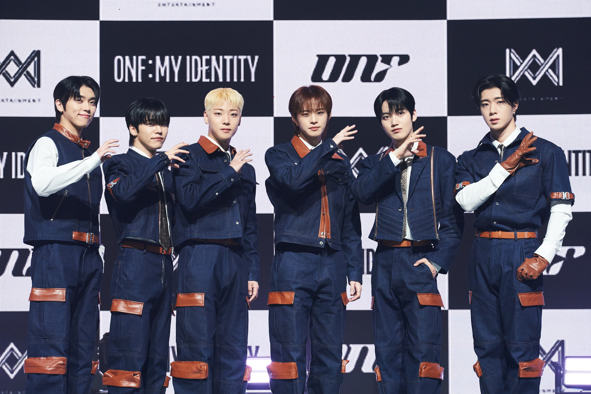 Boy band ONF poses for photos during a showcase held on Feb. 18 at the Blue Square in central Seoul. [WM ENTERTAINMENT]
