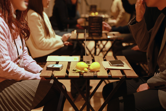 Participants in the Seoul city government's matchmaking program converse during the event held at Hanwha General Insurance office in Yongsan, central Seoul, on Feb. 14. [SEOUL METROPOLITAN GOVERNMENT] 