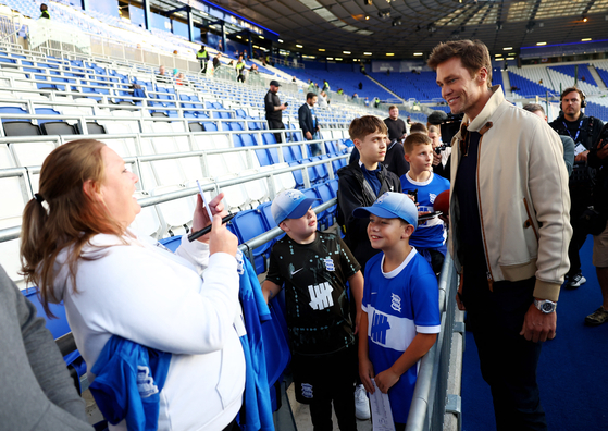 Tom Brady with Birmingham City fans before a match on Sep. 16, 2024 [REUTERS/YONHAP]