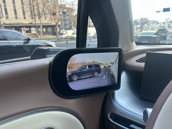 Cameras replace standard side mirrors. [SARAH CHEA]