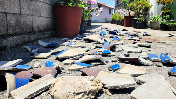 Broken roof tiles litter the ground in Buan County, North Jeolla, on June 12, 2024 after an earthquake hit the region. [NEWS1]