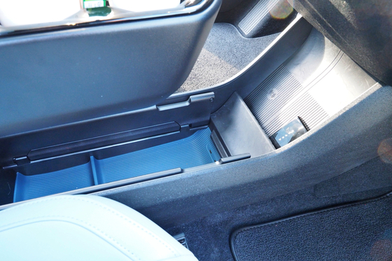 The EX30 has hidden storage underneath the armrest [SARAH CHEA]