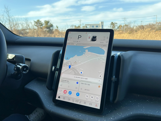 Everything can be controlled with a 12.3-inch vertical touchscreen, from controls for side mirrors and seat adjustment. [SARAH CHEA]