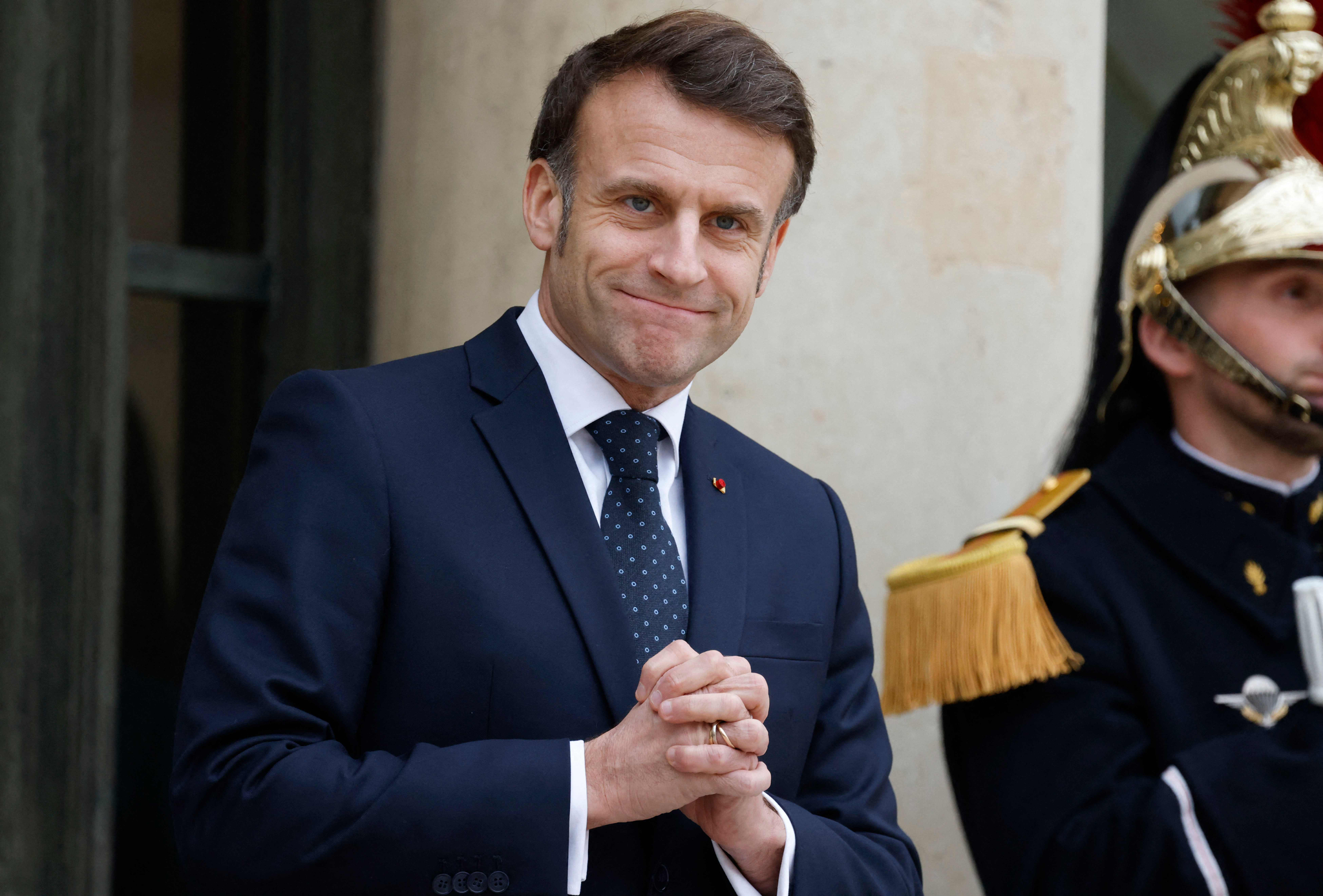 France's President Emmanuel Macron gestures as he waits for Romania's interim President for talks at the Elysee presidential Palace in Paris on Feb. 19. [AFP/YONHAP]