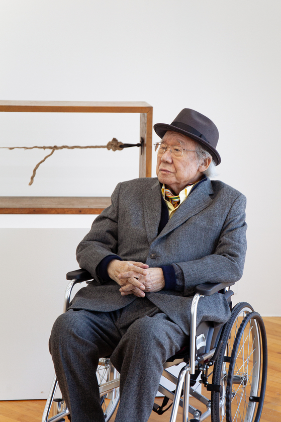 Ha Chong-hyun poses alongside his "Relation 72-1" (1972/2025) installation at the Art Sonje Center in central Seoul on Feb. 13. [ART SONJE CENTER]