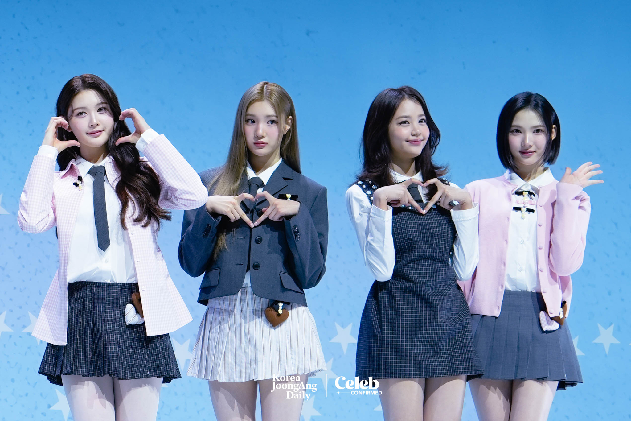 Girl group Hearts2Hearts poses for photos during a showcase held on Feb. 24 at Yes24 Live Hall in eastern Seoul for the release of its first single “The Chase.” [DANIELA GONZALEZ PEREZ]