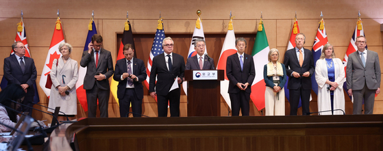 U.S. Deputy Secretary of State Kurt Campbell, fifth from left, First Vice Foreign Minister Kim Hong-kyun, center, and Japanese Vice Foreign Minister Masataka Okano, seventh from left, pose for a photo with the ambassadors of participating countries on a multilateral sanctions monitoring team as they announce its launch in a press conference at the Foreign Ministry in Seoul on Oct. 16, 2024. [KIM KYEONG-ROK]